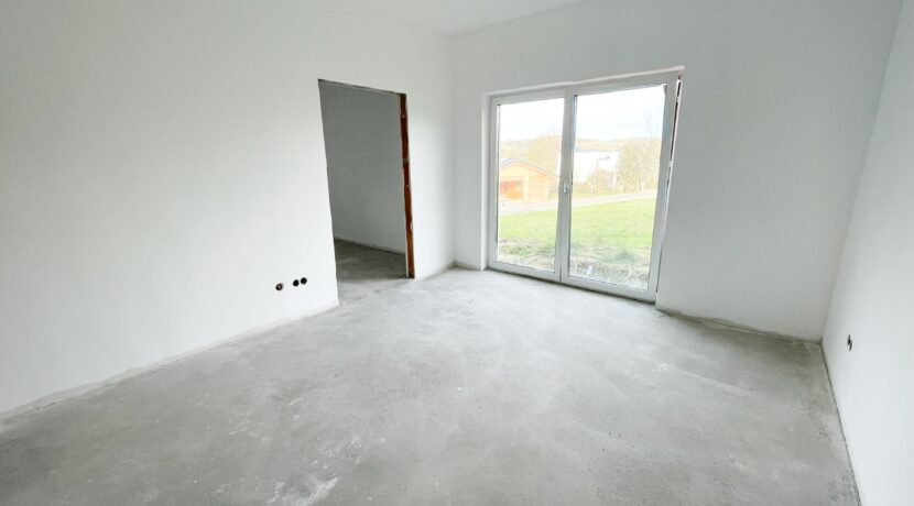 Schlafzimmer mit Ankleide im Rohbauzustand