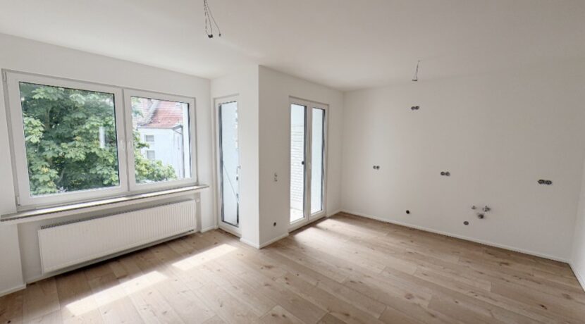 Wohnzimmer mit offener Küche